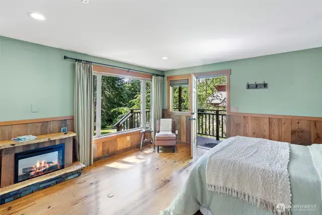 Studio cottage with custom mantle over electric fireplace.