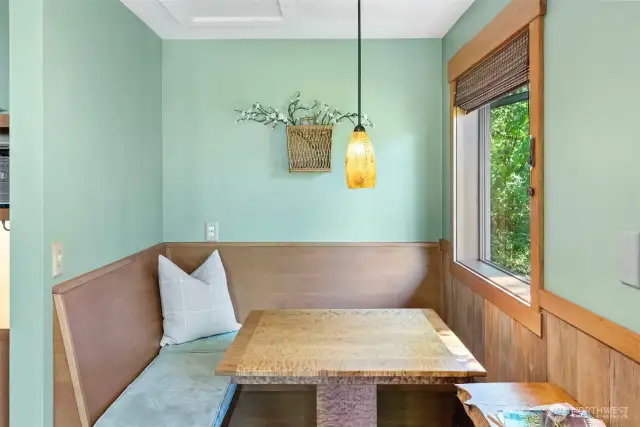 Custom wooden table encircled by seating