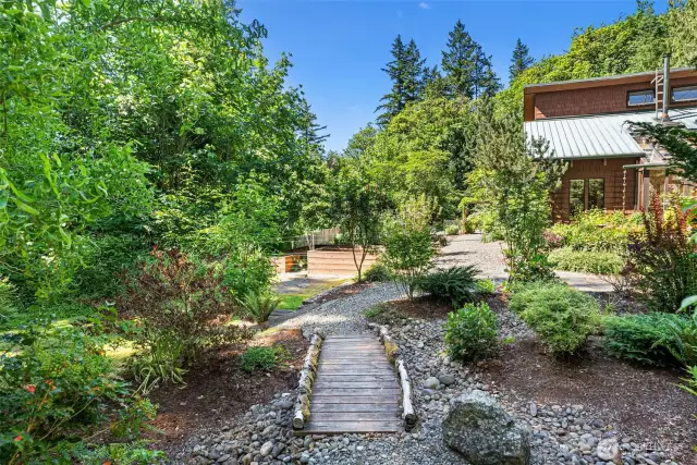Two wooden bridges cover the seasonal creek bed
