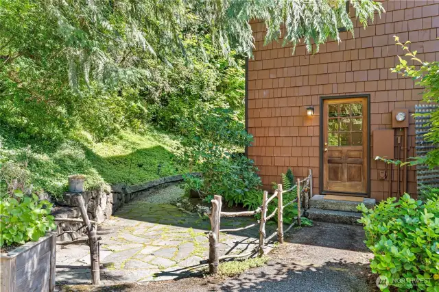 Stone patios and pathways situated around the property