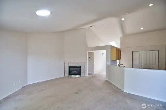 Living room comes with a cozy gas fireplace.