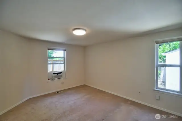 Another view of the primary bedroom showing AC unit.