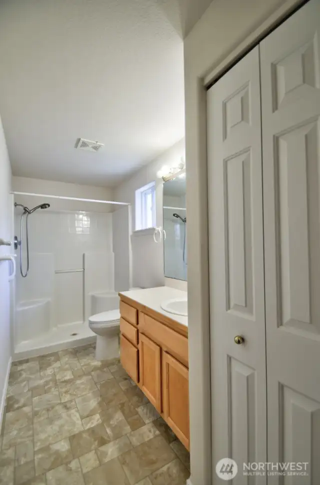 Primary bathroom with walk-in shower.
