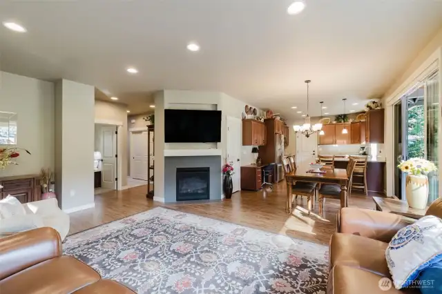 Great room with view of fireplace and hall entrance