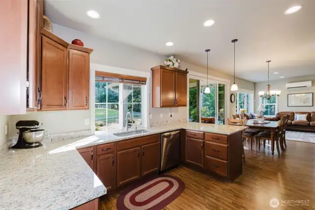 Kitchen, granite countertops, wooden blinds and custom lighting