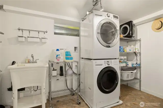 The large laundry room is off the garage. This makes it ideal for use by the main house, the DADU and the lower level if you set is up as a MIL. Each unit can access the laundry without going through another unit.