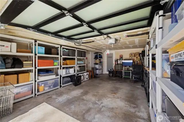 The extra deep garage has room for a car PLUS lots of storage. There's a workbench on the right. The spacious laundry room is off the back.