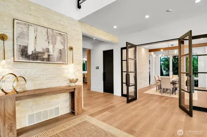 A stacked stone wall provides a beautiful accent in the foyer