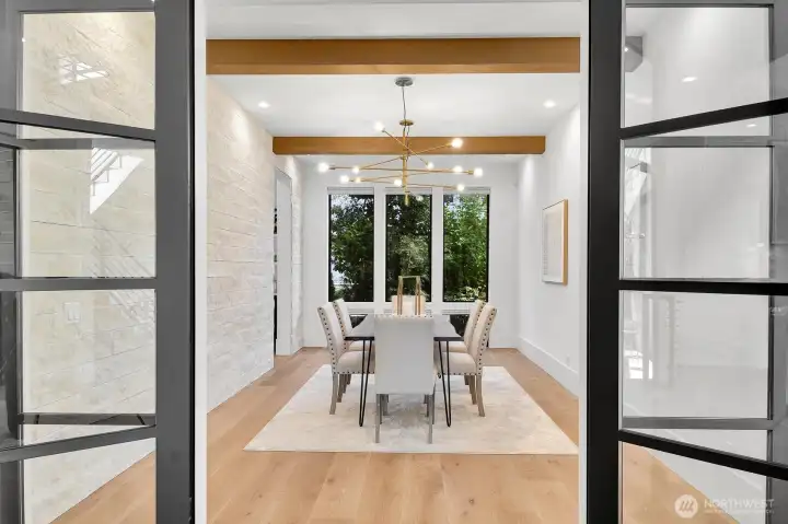 French doors open to the formal dining room