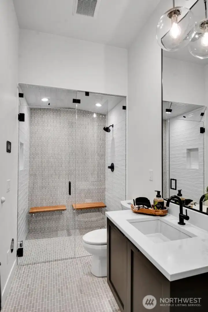 3/4 bathroom with steam shower in lower level