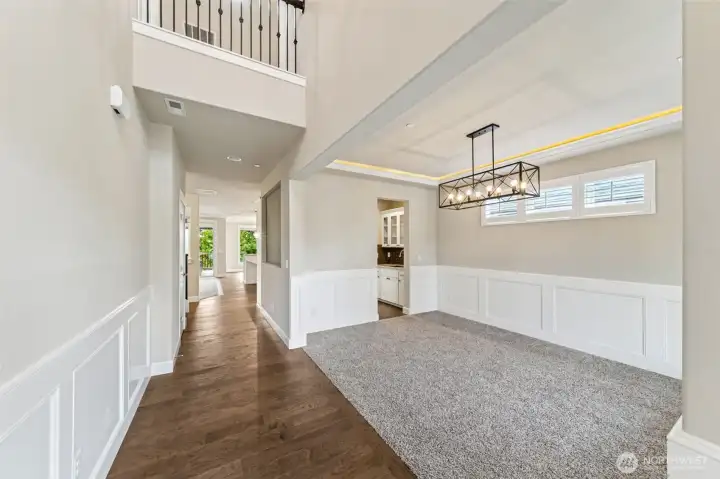 Grand entryway with open ceiling. Use room on the right for a formal dining or sitting area