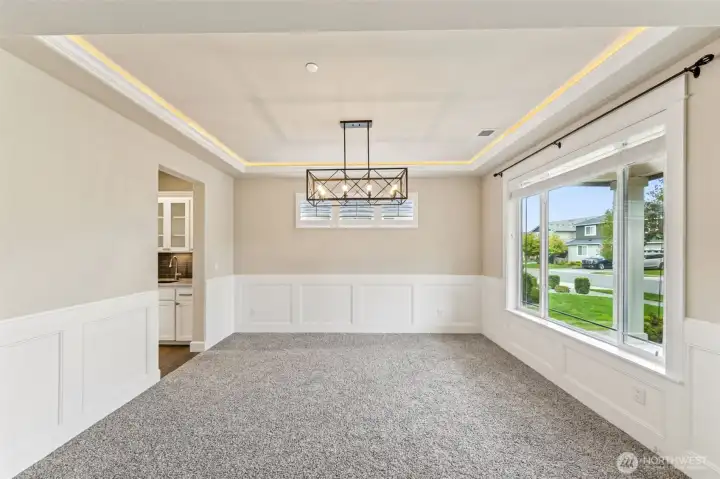 Formal dining or sitting area, this room has tons of natural light and flexible use options