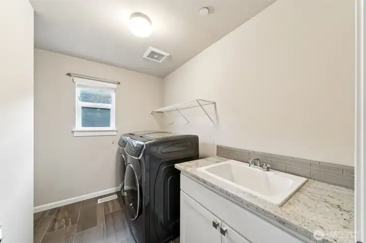 Upstairs utility room with sink