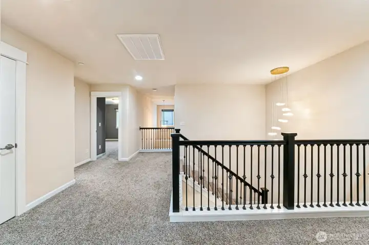 Great upstairs layout. View from the primary bedroom door