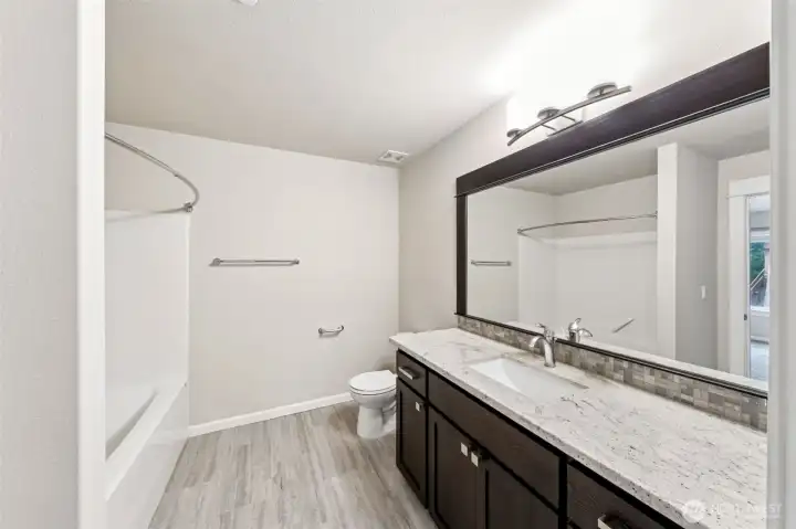 Basement full bath. Enter from the hallway or the basement bedroom