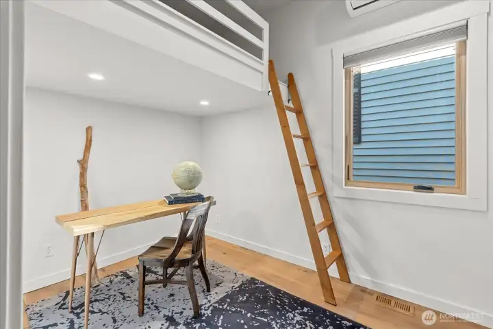 Just off the main living area, bedroom w/ loft and a handcrafted white oak ship ladder offers flexibility or creative use.
