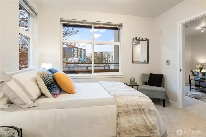 Start every day with soft morning light and birds singing outside your window - this bedroom is your ideal in-city retreat!