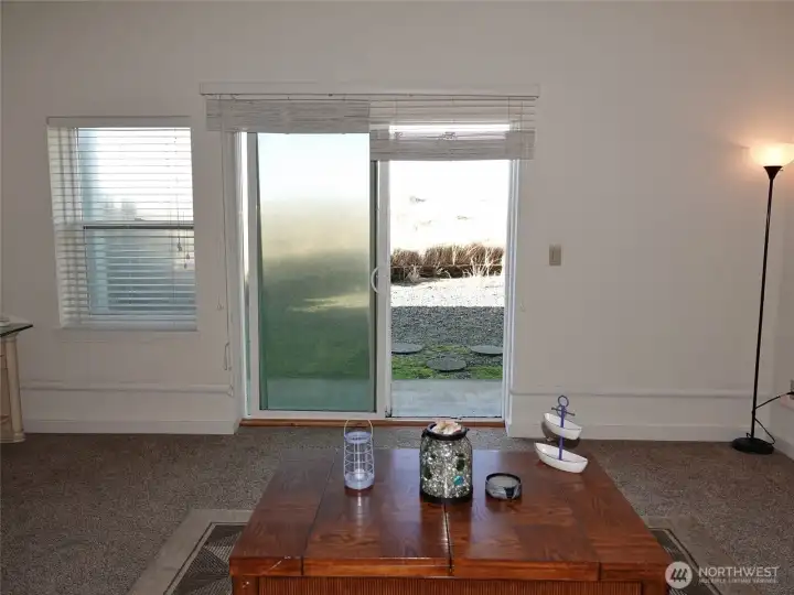 Living Room with a slider to the backyard and the Dunes Area behind the property.