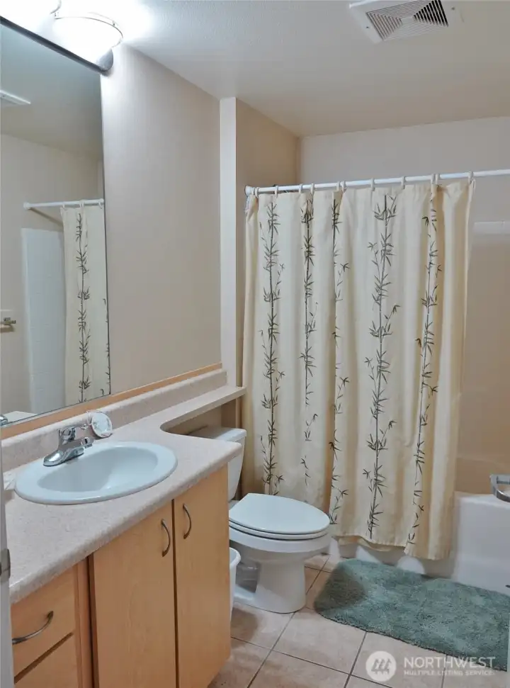 Full Bathroom w/ tile floors.
