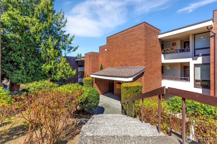 Steps heading down to the stairwell going up 1½ floors to your future home.