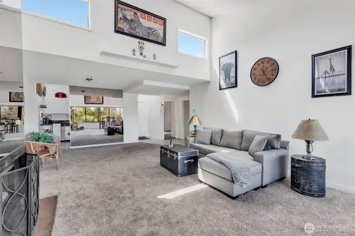 Looking west towards kitchen and dining area.  Note vaulted ceiling and clearstory windows above.