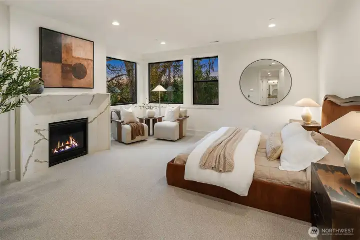Designer primary suite with fireplace