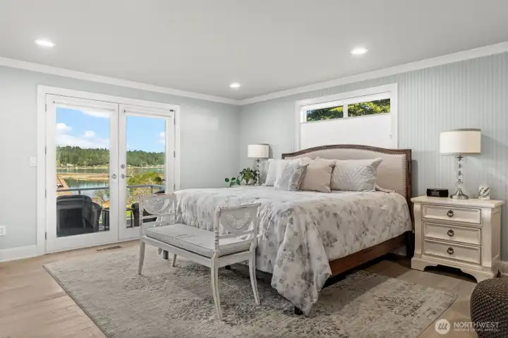 Primary on the main has a view, plus storage galore! With three closets (including the walk in), a built in dresser and closet systems for organization in each one.