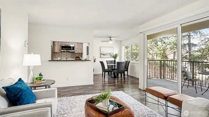 Living room is open to the dining room. Serve guests refreshments from the kitchen bar!