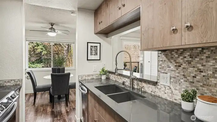 Kitchen with additional upgraded cabinets and quartz counters.