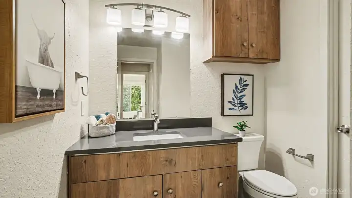 Half-bath has access from hall and connects to the shared shower.