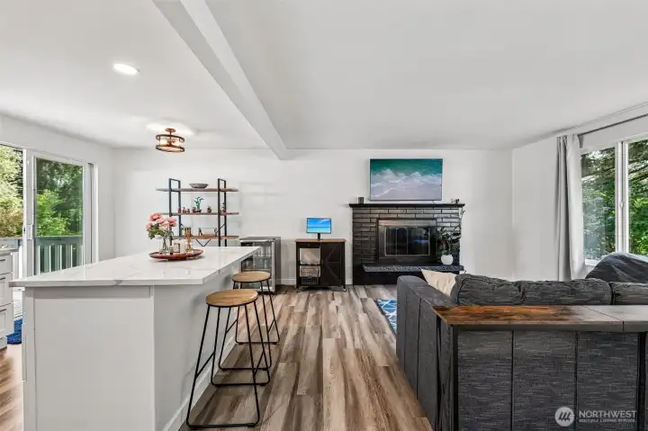 Great kitchen island with eating space adjacent to dining and living room
