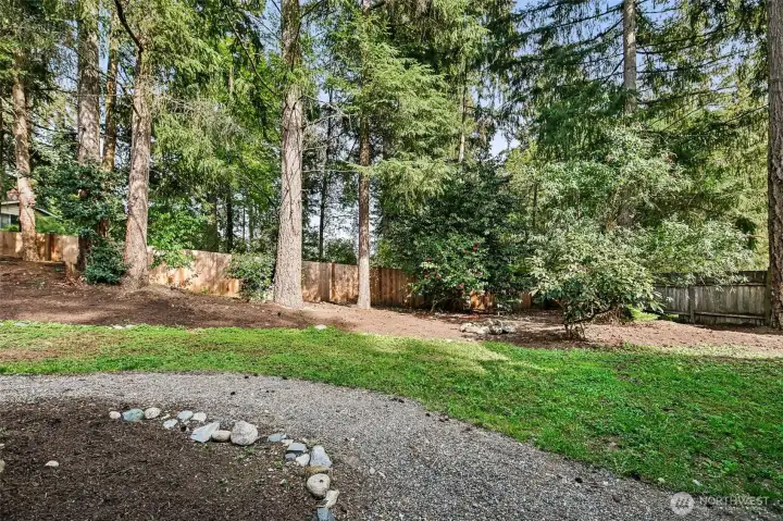 Spacious back yard is fully fenced.
