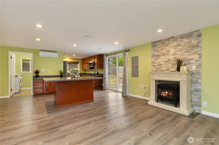 A beautiful electric fireplace serves as the focal point of the living room.