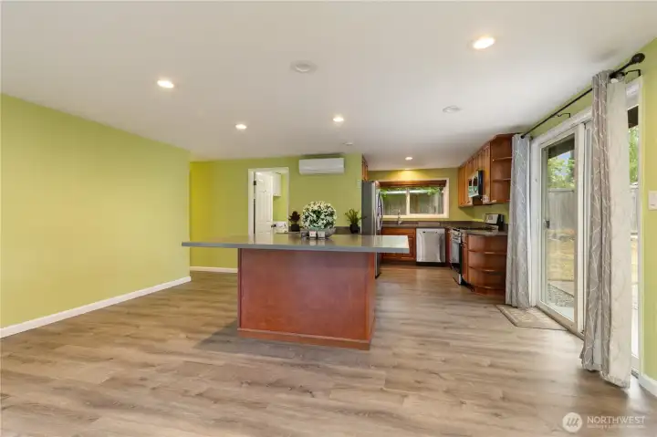A heat pump with air conditioning is installed in both the kitchen and living room.