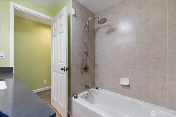 A full bathroom with a bathtub.