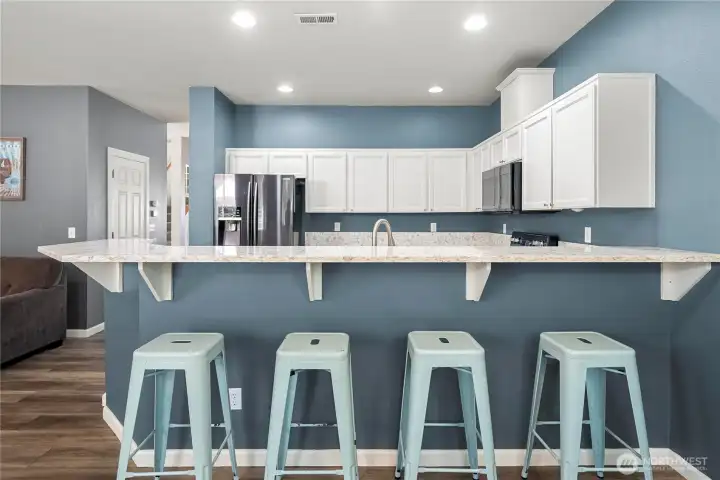 Cheerful kitchen with newer  quartz countertops