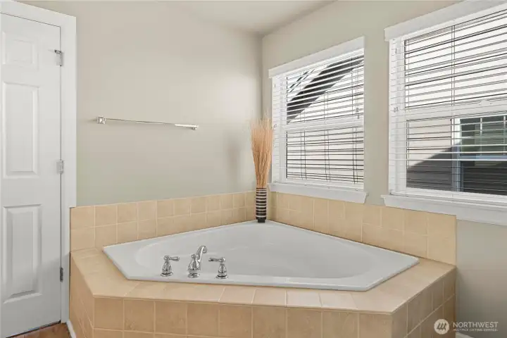 Large Corner soaking tub - just ad the bath bomb.