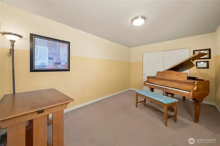 Private downstairs office/den with closet.