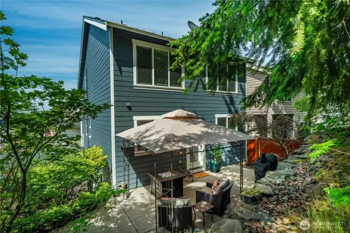The beautifully landscaped back patio has been enlarged for extra entertaining space.