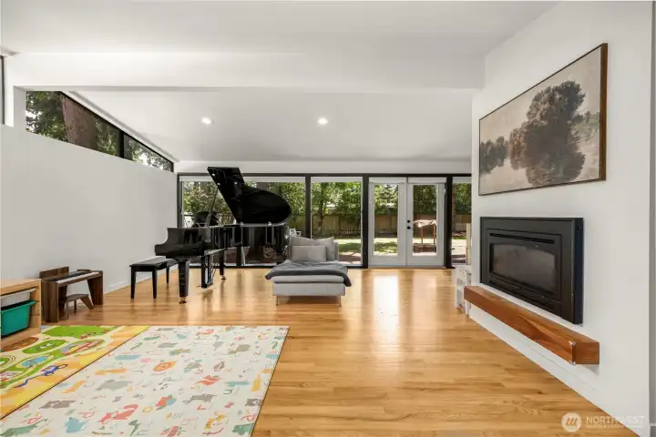 Airy, light-filled open-plan Living Room with floor-to-ceiling windows, overlooks private Back Patio & Yard!
