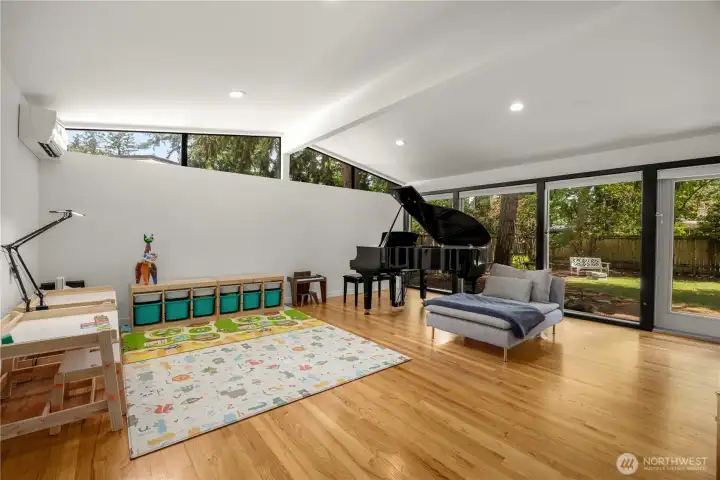 Living Room with high cathedral ceiling and clerestory window lighting!