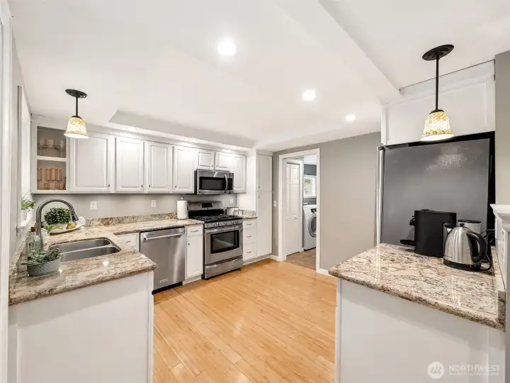 The heart of the home, this bright and spacious kitchen offers granite countertops, stainless steel appliances, generous cabinetry, and plenty of workspace for everyday meals and entertaining.