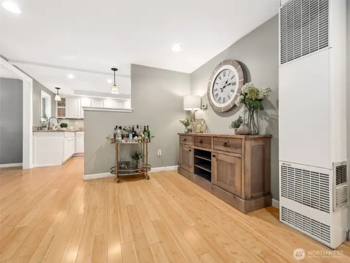 A versatile flex space seamlessly connects the living room, dining room, and kitchen—perfect for a buffet during gatherings, a coffee bar, reading nook, home office, or additional entertaining space