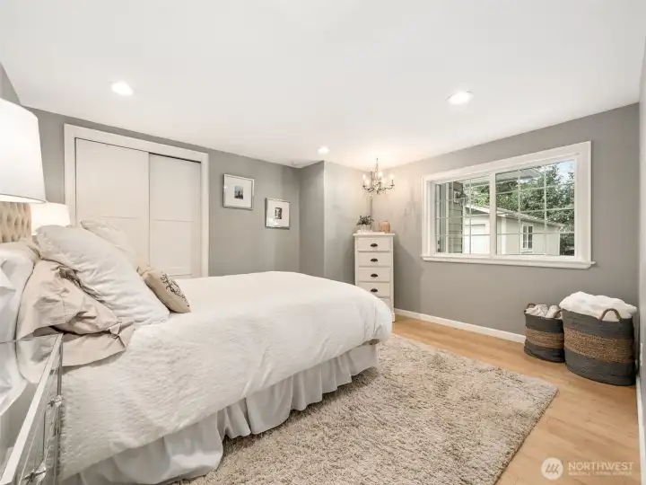 Bedroom 1 of 3 . . . so charming! This bright, comfortable bedroom offers bamboo flooring, a large picture window, recessed lighting, and a calming color palette designed for restful living.