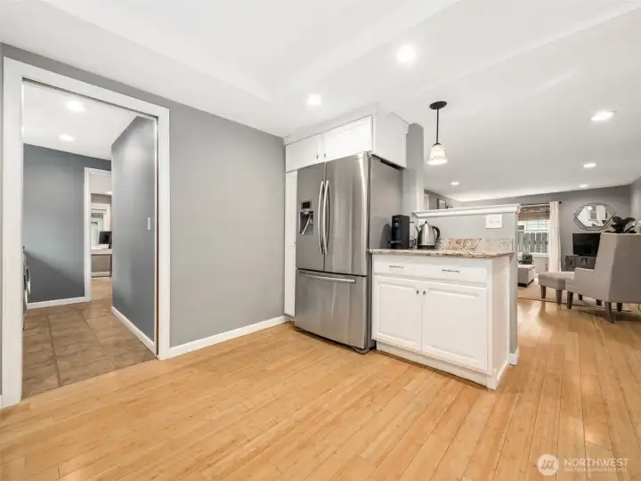 The laundry room is conveniently off the kitchen, with the 3rd bedroom beyond.