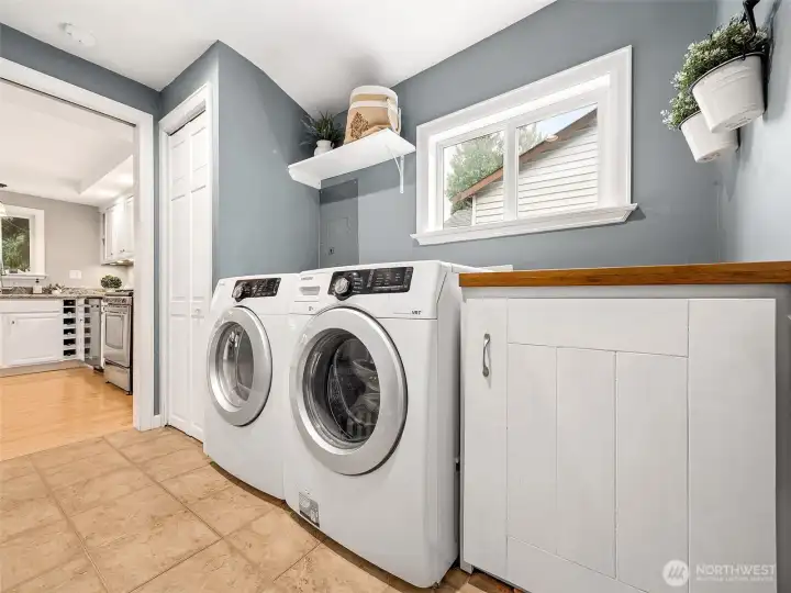 Cabinet & folding surface round out the laundyroom plus the washer & dryer stay!