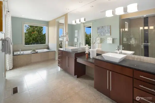This 5-piece, luxurious bathroom suite provides a spa-like environment complemented by an enormous walk-in closet.