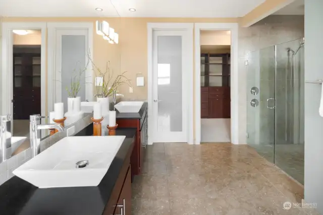 Another view of the spacious, pristine primary bathroom suite with private commode.