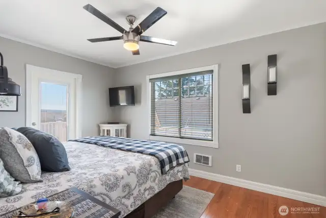Primary bedroom has access to the back deck.
