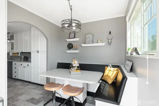 Built in bench and barstools that stay with great natural light!